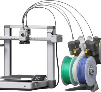 Bambu Lab A1 Combo 3D printer with AMS Lite system printing a multi-color object on a compact desktop setup
